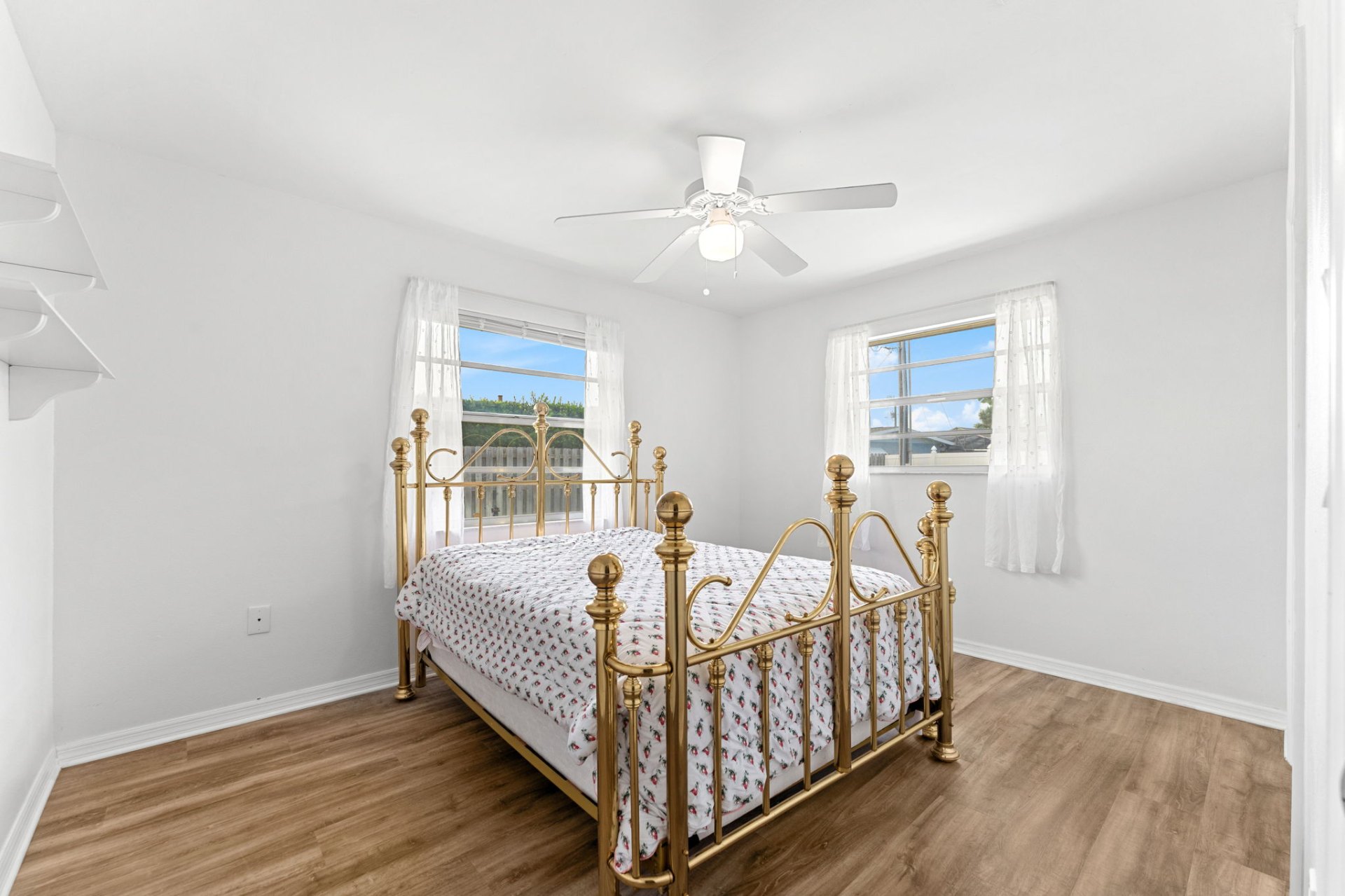 Second bedroom with twin windows and natural light