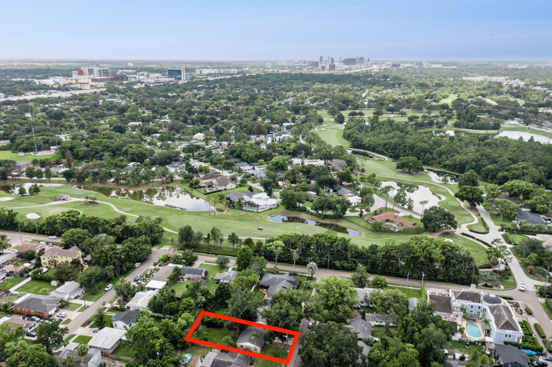 Aerial view over Dubsdread Golf Course toward downtown Orlando with 846 Driver Ave outlined
