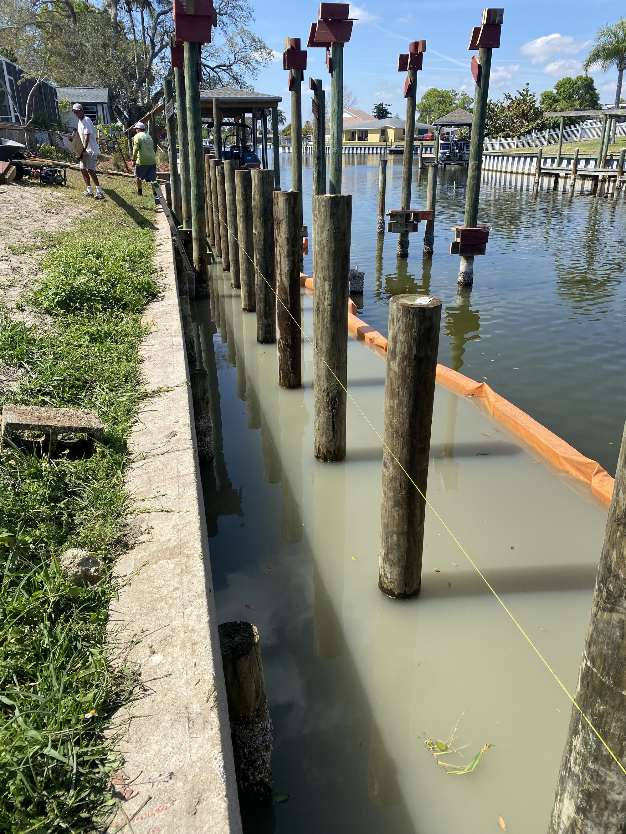 Marine contractors building a new seawall at a Diana Shores canal-front home in Merritt Island